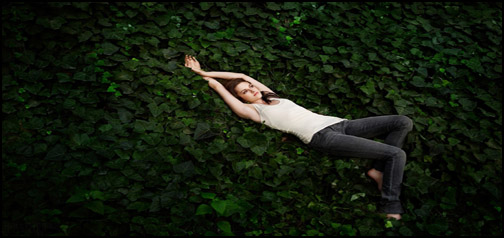 Kirsten Stewart Laying on Leaves.